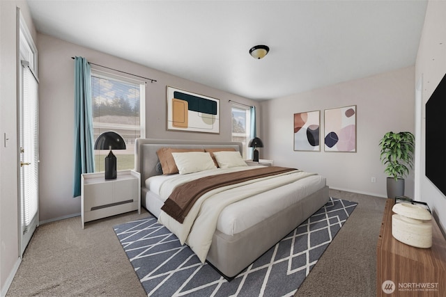 carpeted bedroom featuring baseboards