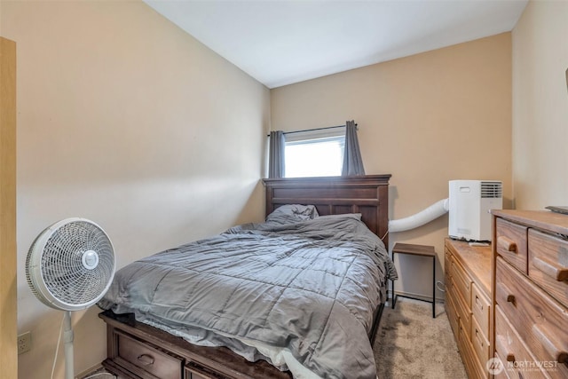 bedroom with light colored carpet