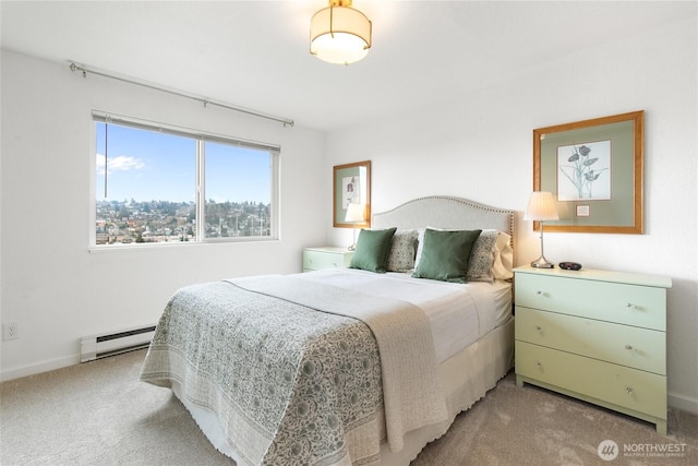 bedroom featuring light colored carpet and baseboard heating