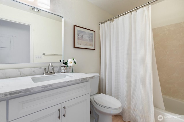 full bathroom featuring vanity, shower / tub combo, and toilet