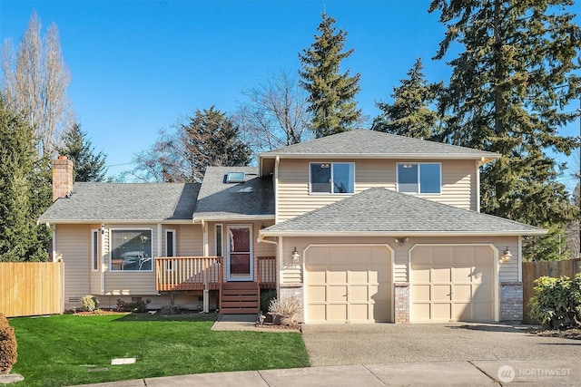 view of front of house with a garage and a front yard