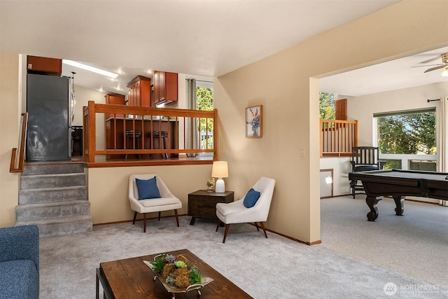 carpeted living room featuring billiards and ceiling fan