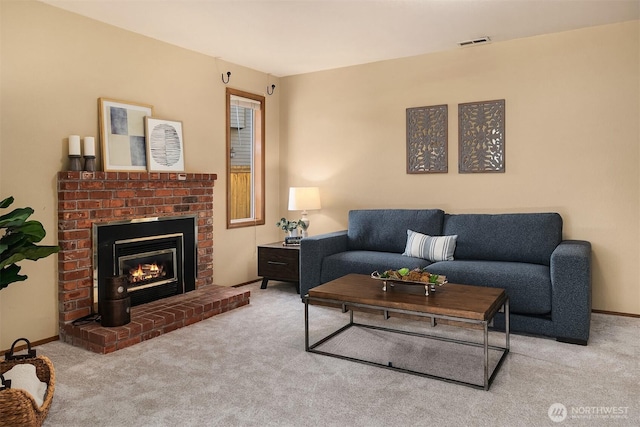 carpeted living room featuring a brick fireplace