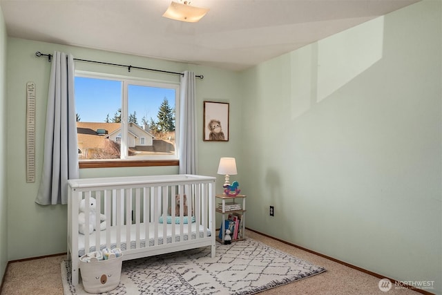 carpeted bedroom with a crib