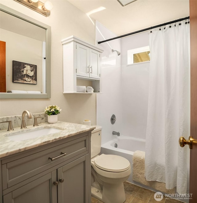 full bathroom with vanity, toilet, and shower / tub combo