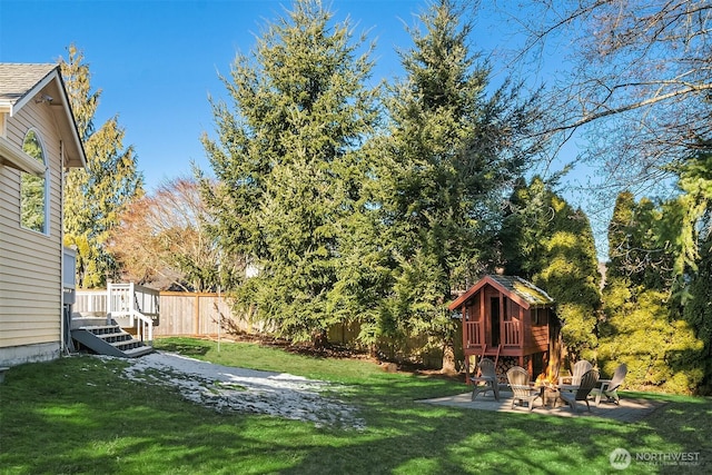 view of yard with a patio area and a fire pit