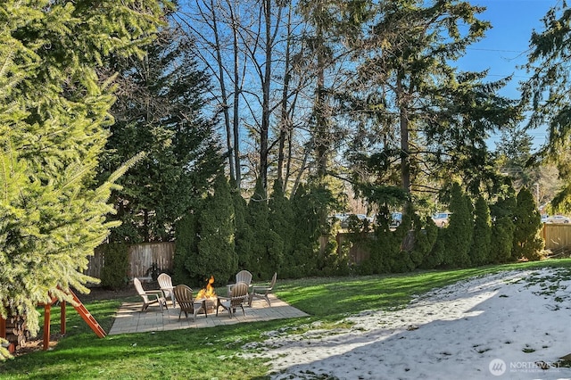 view of yard with an outdoor fire pit and a patio area