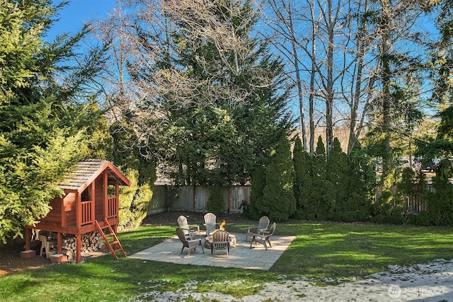 view of yard with a fire pit and a patio area