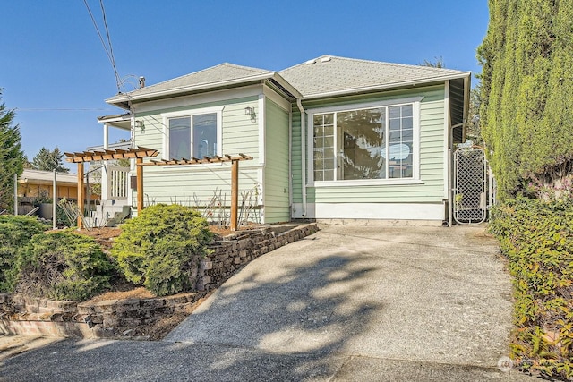 view of front of home featuring a pergola