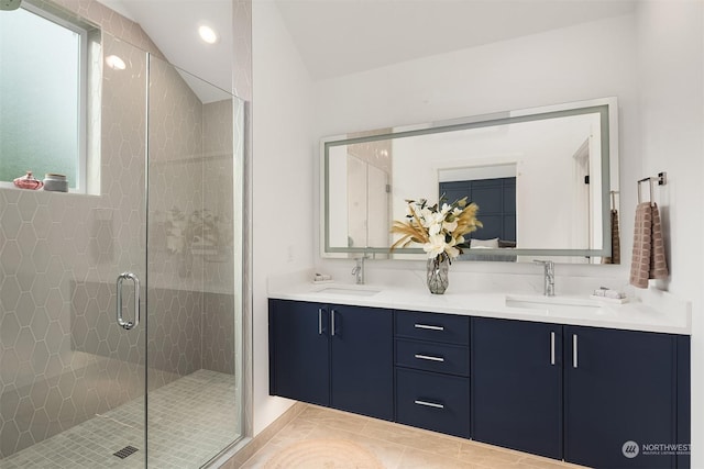 bathroom with vanity and an enclosed shower