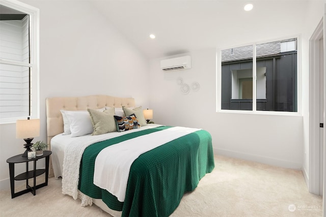 bedroom featuring light colored carpet, vaulted ceiling, and an AC wall unit