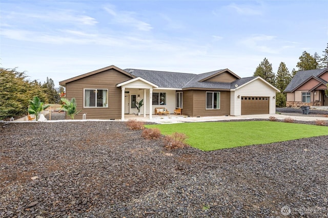 view of front facade with an attached garage, driveway, a shingled roof, and a front yard