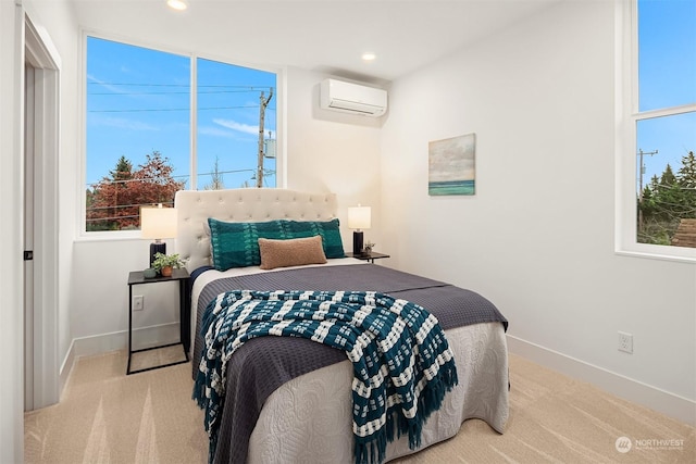 bedroom featuring a wall mounted air conditioner and light carpet