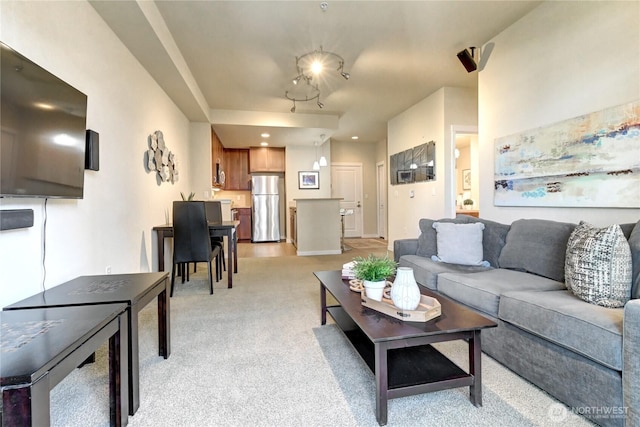 living room featuring light colored carpet