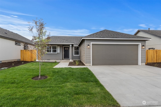 single story home featuring a garage and a front yard