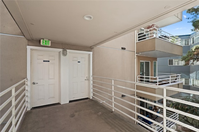 entrance to property featuring a balcony