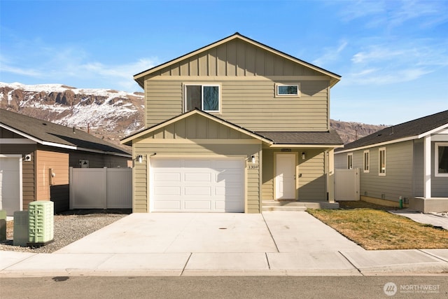 view of front property featuring a garage and a mountain view