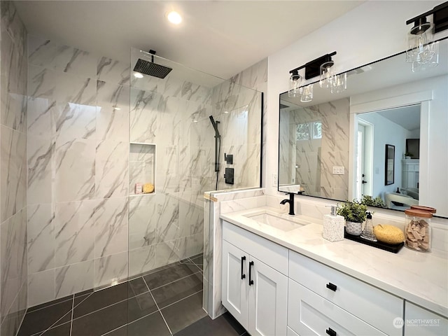 full bathroom featuring tile patterned floors, a marble finish shower, vanity, and recessed lighting