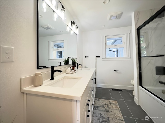 full bathroom featuring tile patterned flooring, a sink, toilet, and baseboards