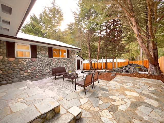 view of patio / terrace featuring fence and an outdoor living space