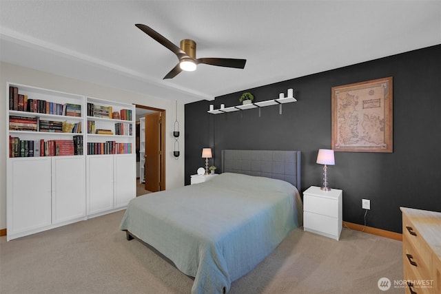 bedroom with light carpet and ceiling fan