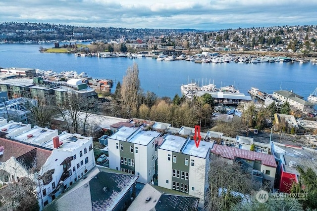 birds eye view of property featuring a water view