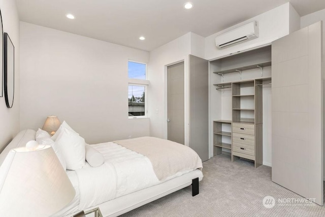 bedroom featuring light colored carpet and a wall unit AC