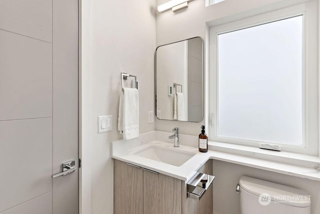 bathroom with vanity and toilet