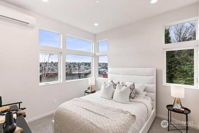 bedroom featuring a water view, multiple windows, carpet flooring, and a wall unit AC