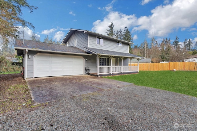 view of front facade featuring a garage, a porch, and a front lawn