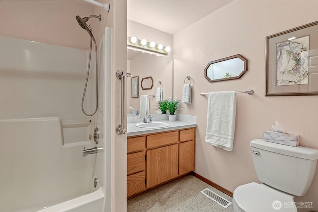 full bath with toilet, speckled floor, vanity, visible vents, and baseboards