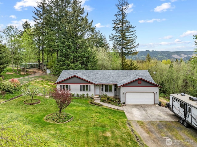 ranch-style house with a shingled roof, concrete driveway, an attached garage, and a front lawn