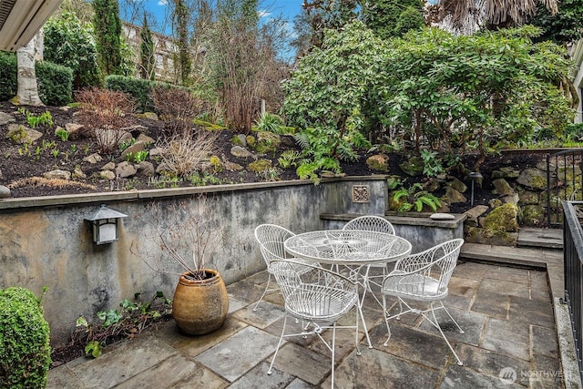 view of patio featuring outdoor dining area