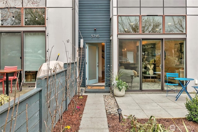 property entrance with a patio