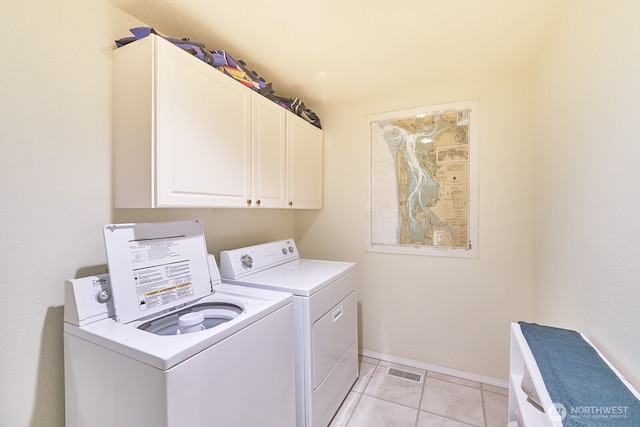 32208 G St, Ocean Park, WA 98640 - washroom featuring light tile patterned floors, washing machine and dryer, and cabinets