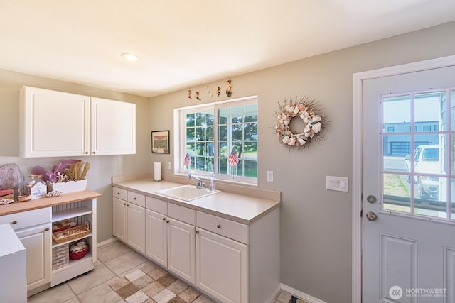 32208 G St, Ocean Park, WA 98640 - kitchen featuring light tile patterned flooring, sink, and white cabinets