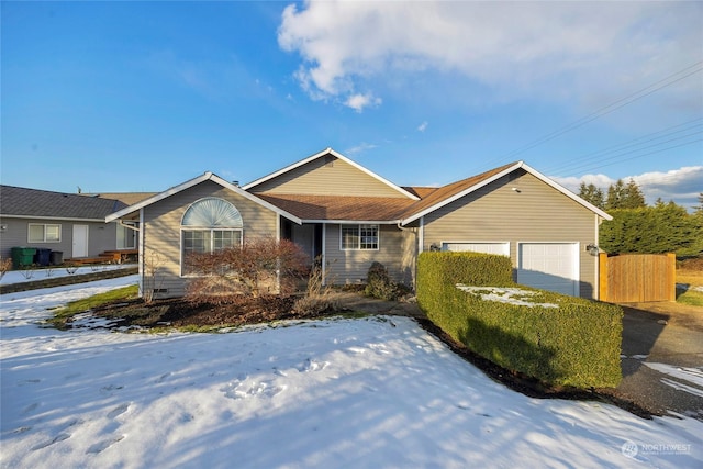 single story home featuring a garage