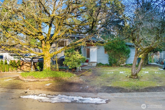 view of property hidden behind natural elements