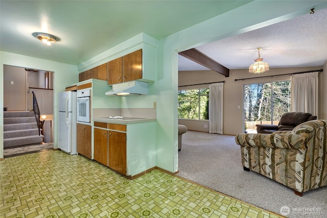 kitchen featuring white appliances, hanging light fixtures, beam ceiling, a notable chandelier, and light carpet