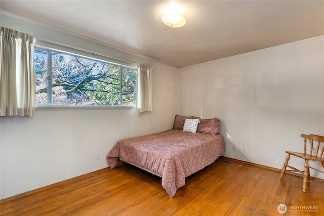 bedroom featuring hardwood / wood-style flooring