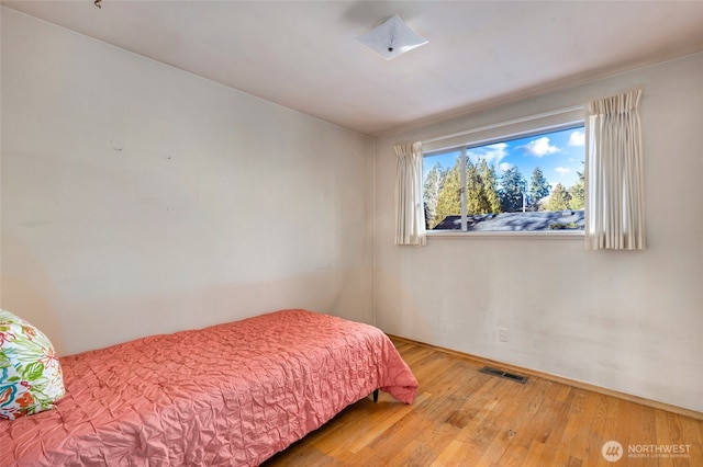 bedroom featuring hardwood / wood-style flooring