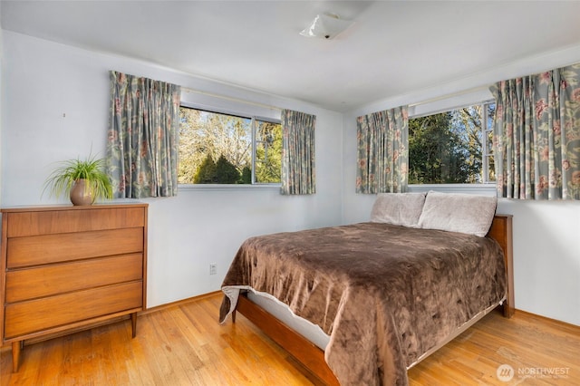 bedroom with light hardwood / wood-style floors