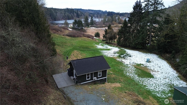 aerial view with a forest view and a water view