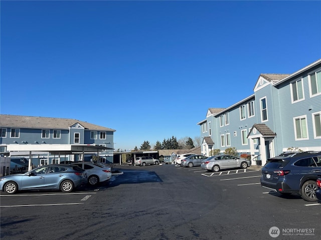 view of vehicle parking with a carport