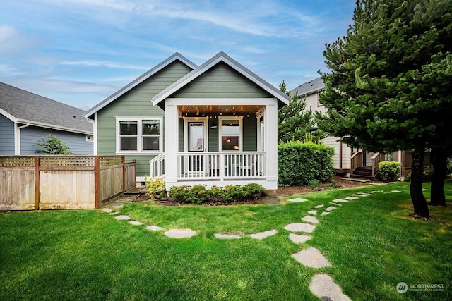 view of front facade with covered porch and a front lawn