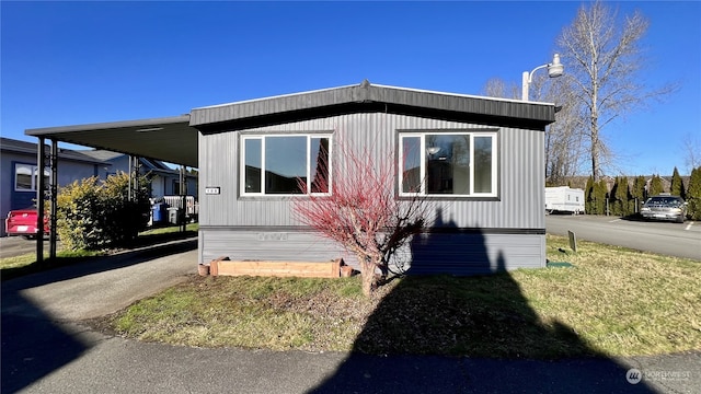 view of home's exterior featuring a carport