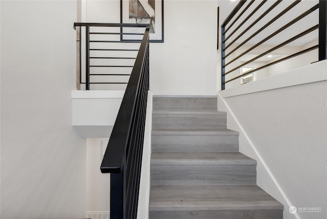 stairway with wood-type flooring