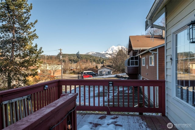 wooden deck with a mountain view