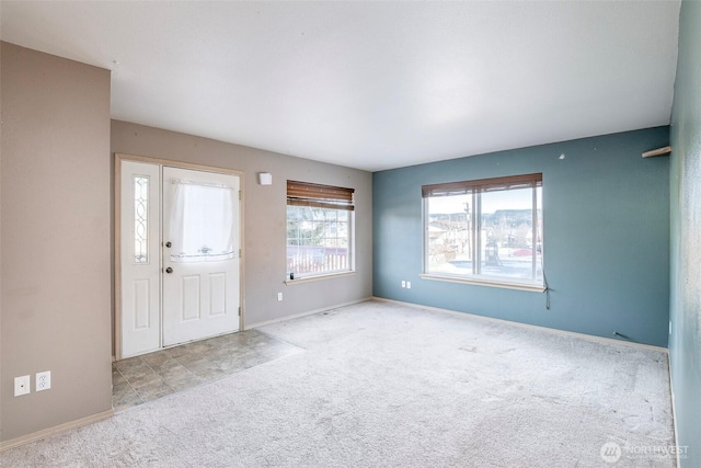 view of carpeted foyer