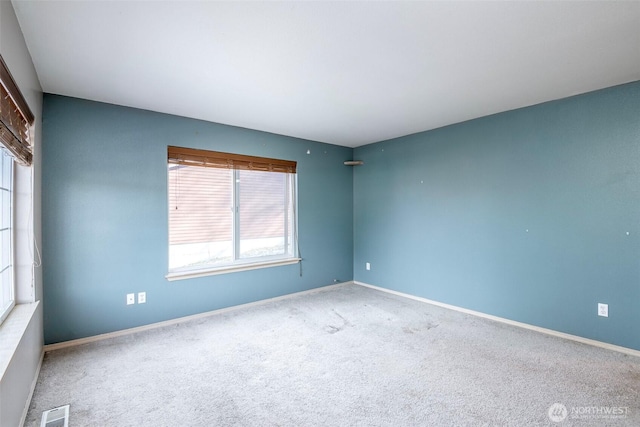 empty room featuring carpet flooring